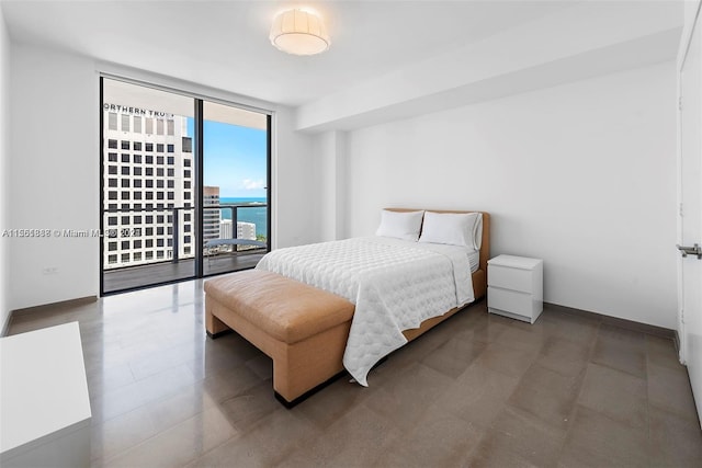 bedroom with a wall of windows, access to outside, and a water view