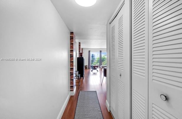 hall featuring dark wood-type flooring