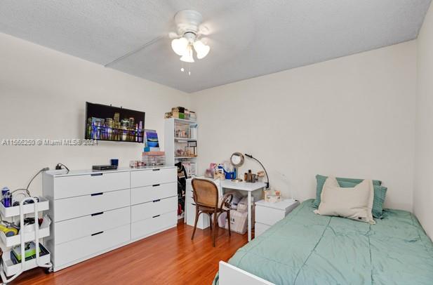 bedroom featuring hardwood / wood-style floors and ceiling fan