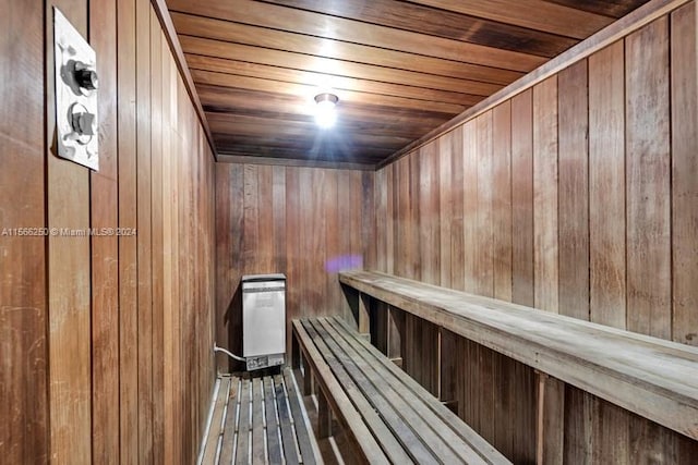 view of sauna featuring wooden walls and wooden ceiling