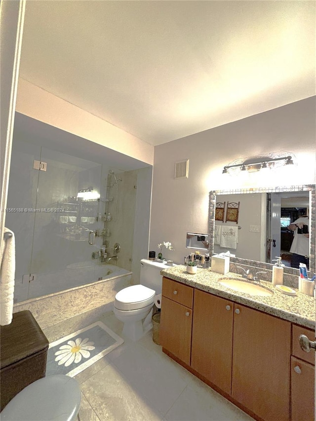 full bathroom with enclosed tub / shower combo, vanity, toilet, and tile patterned floors