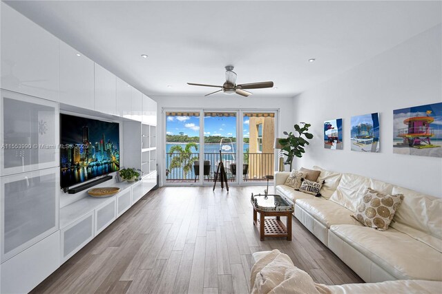 4234 N Ocean Dr, Hollywood, FL 33019 - living area featuring a ceiling fan, wood finished floors, and recessed lighting