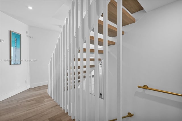 4234 N Ocean Dr, Hollywood, FL 33019 - staircase featuring wood finished floors and recessed lighting