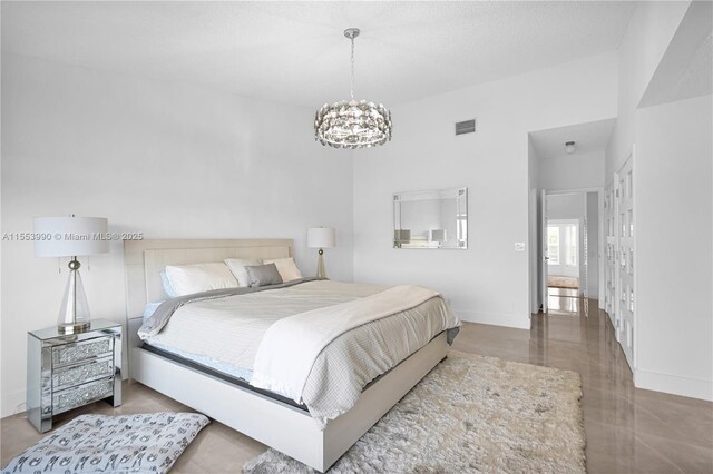 bedroom with an inviting chandelier