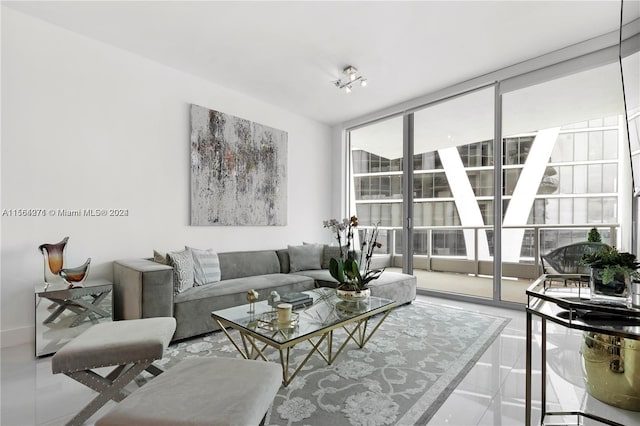 tiled living room featuring floor to ceiling windows and a healthy amount of sunlight