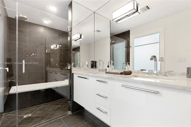 bathroom with tile patterned flooring and double sink vanity