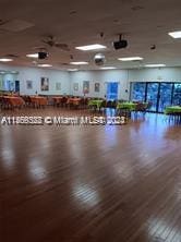 interior space with ceiling fan and hardwood / wood-style flooring