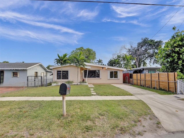 ranch-style house with a front lawn