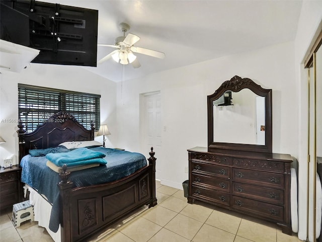 tiled bedroom with a closet and ceiling fan