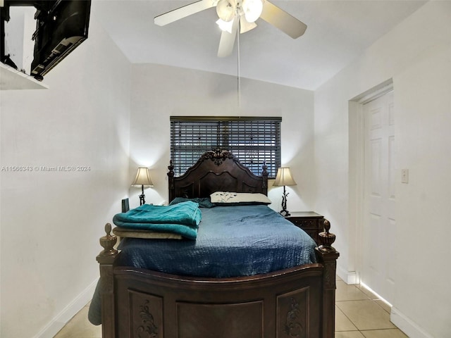 tiled bedroom featuring ceiling fan and lofted ceiling