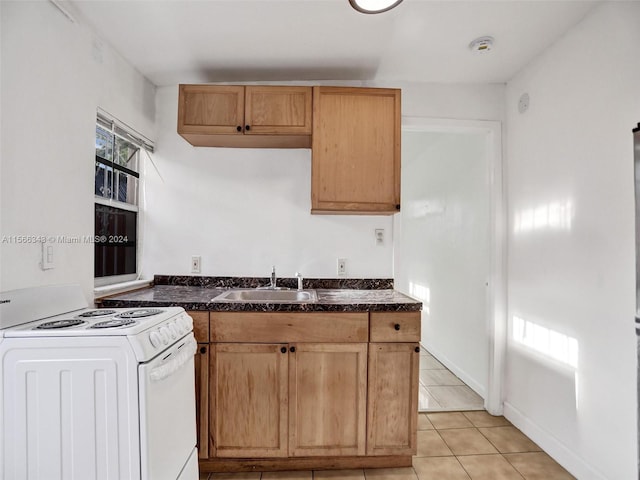 kitchen featuring electric stove, sink, and light tile flooring