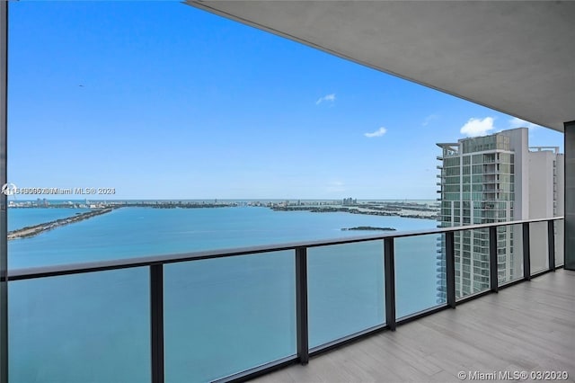 balcony featuring a water view