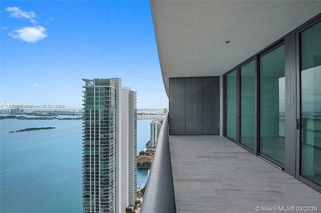 balcony featuring a water view