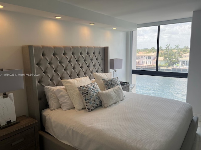 bedroom with floor to ceiling windows