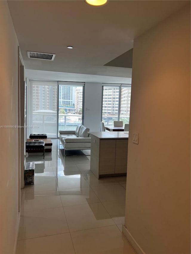 hallway featuring light tile floors