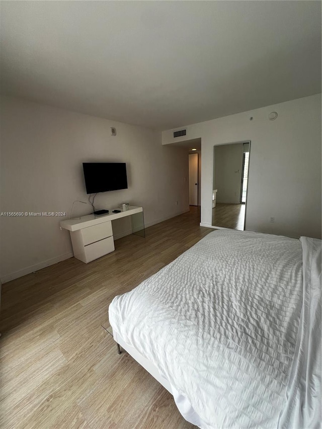 bedroom featuring light hardwood / wood-style floors