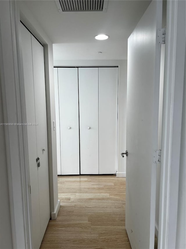 corridor featuring light hardwood / wood-style floors