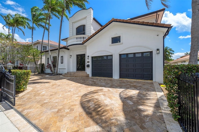 mediterranean / spanish-style home with a garage