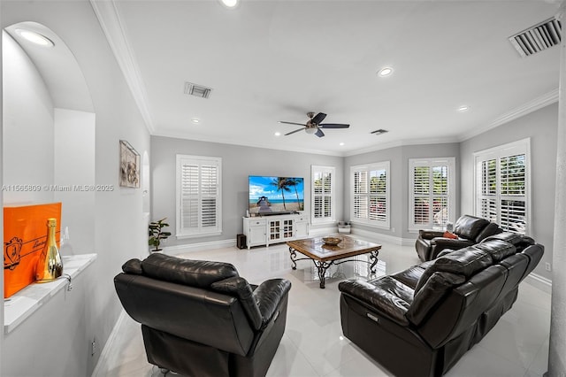 living room featuring crown molding and ceiling fan