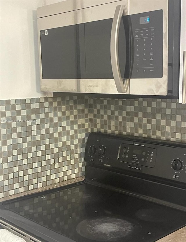 details featuring backsplash and range