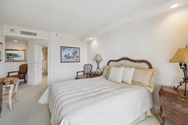 bedroom featuring light colored carpet