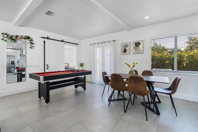 game room featuring beam ceiling, billiards, and a barn door