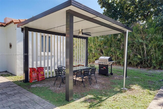 view of patio featuring ceiling fan and a grill