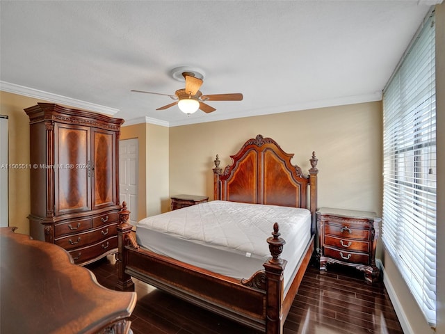 bedroom with ceiling fan, dark wood-type flooring, and crown molding