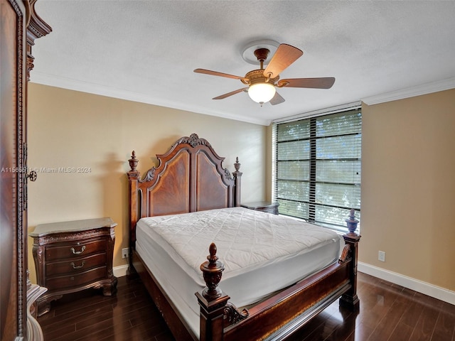 bedroom featuring ceiling fan, dark wood-type flooring, and a textured ceiling