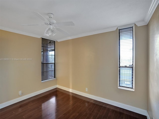 unfurnished room featuring ornamental molding, ceiling fan, and dark wood-type flooring