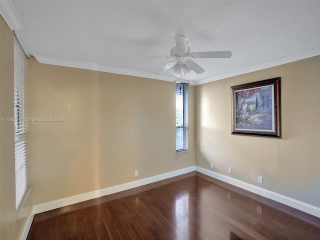 spare room featuring ceiling fan, crown molding, and dark wood-type flooring