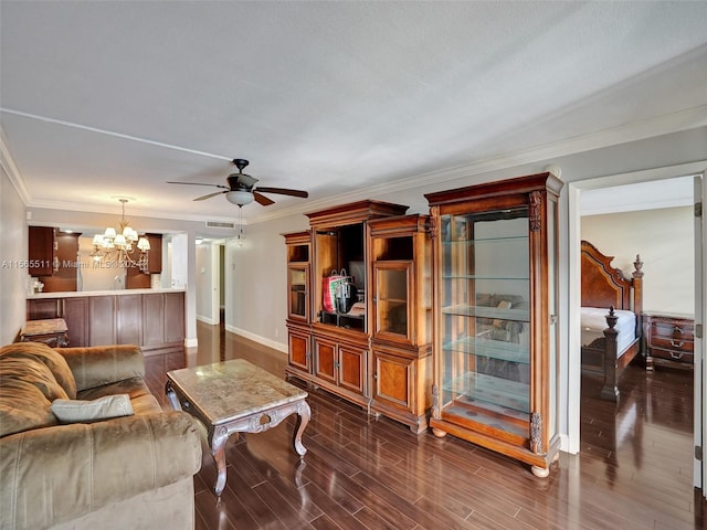 living room featuring crown molding, ceiling fan with notable chandelier, and dark hardwood / wood-style flooring