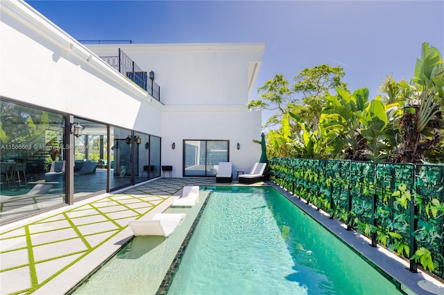 view of swimming pool featuring a patio area