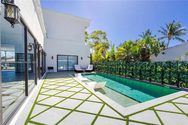 view of swimming pool with a patio