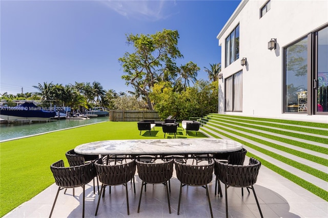 view of terrace with a water view