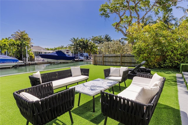 view of terrace with a water view, an outdoor living space, and a dock