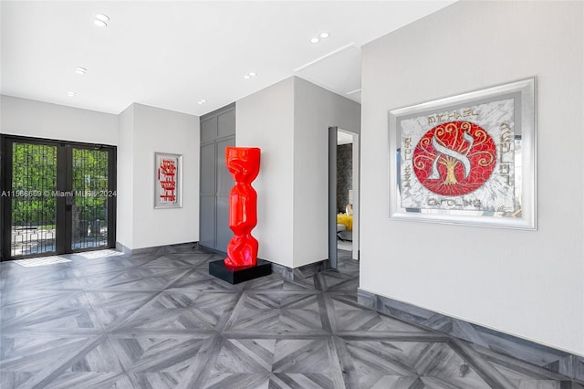 interior space featuring french doors and dark parquet flooring