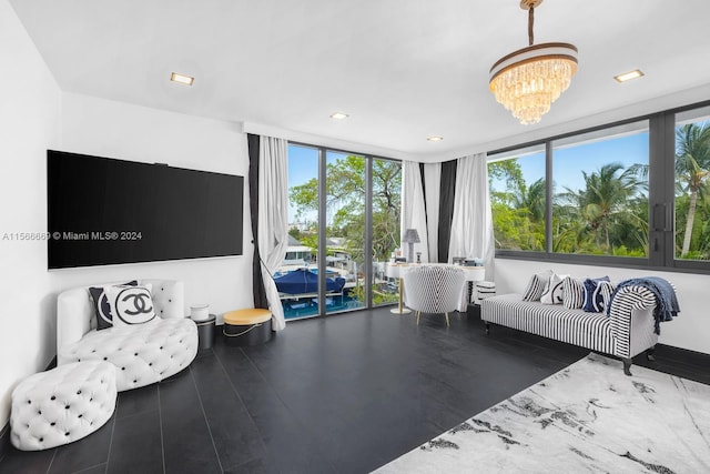 living room with a chandelier and dark wood-type flooring