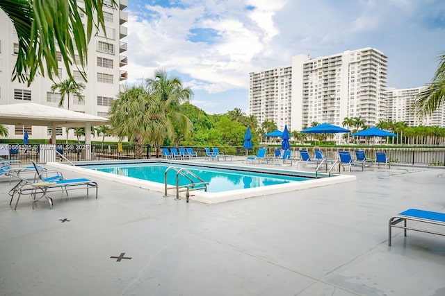 view of swimming pool with a patio