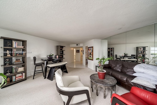 carpeted living room featuring a textured ceiling