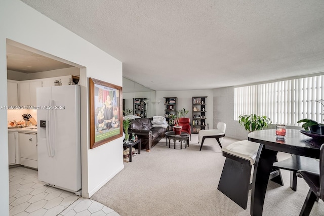 carpeted living room featuring a textured ceiling