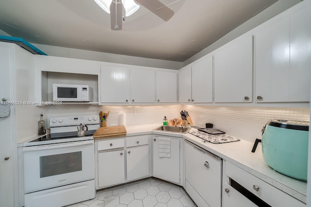 kitchen with tasteful backsplash, ceiling fan, white appliances, light tile floors, and white cabinets