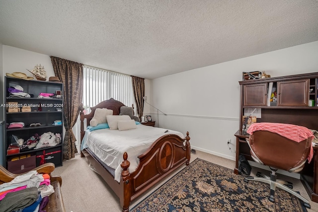 carpeted bedroom featuring a textured ceiling