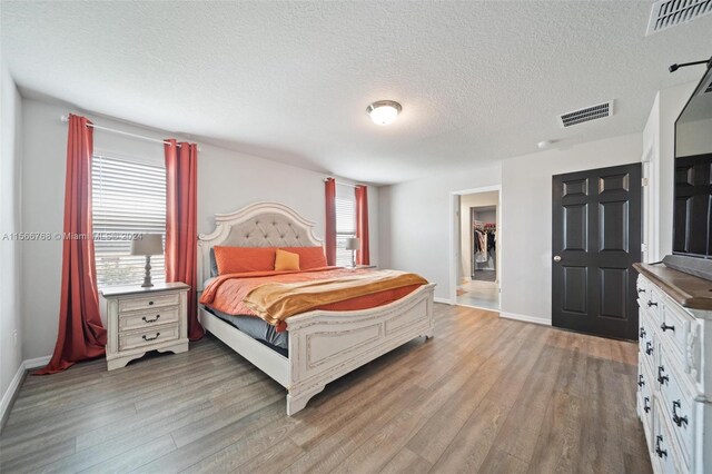 112 Towns, Haines City, FL 33844 - bedroom featuring light wood-type flooring, baseboards, and visible vents