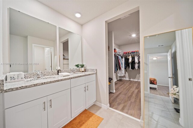 bathroom featuring wood-type flooring and vanity