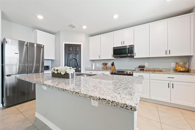 112 Towns, Haines City, FL 33844 - kitchen featuring light tile patterned floors, visible vents, a sink, and appliances with stainless steel finishes