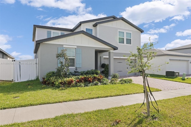 view of front of property with a garage and a front lawn