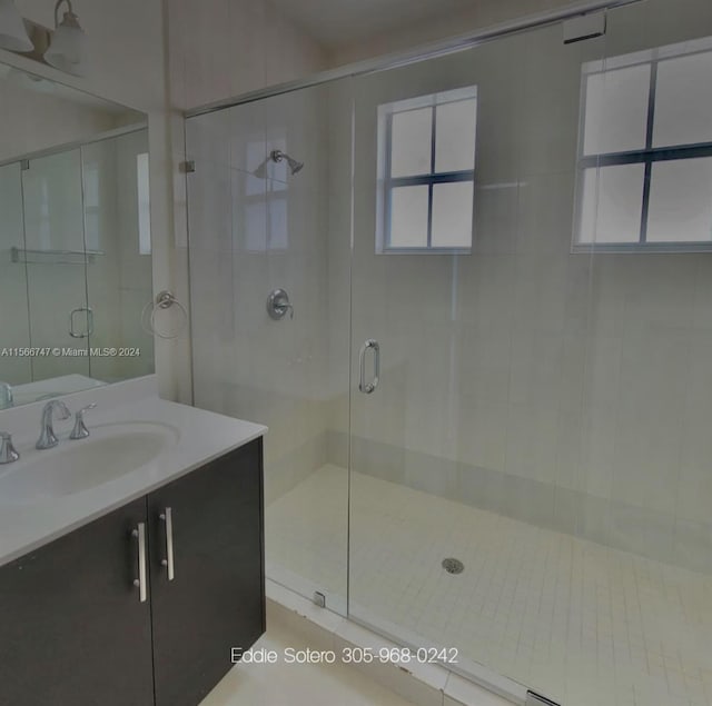 bathroom with vanity and an enclosed shower