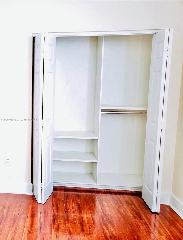 unfurnished room with light wood-type flooring