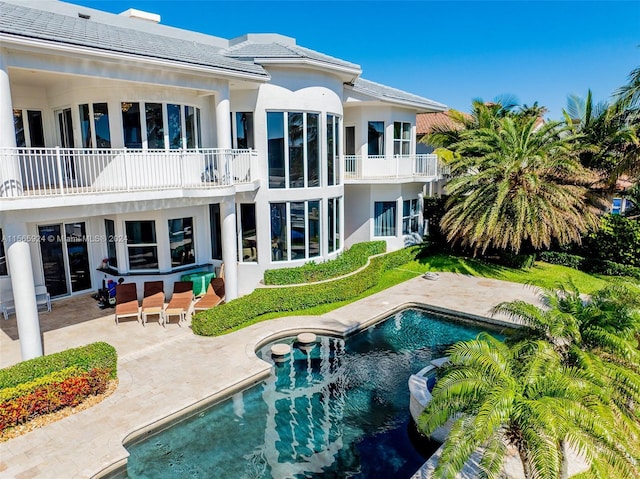 back of property featuring a patio area